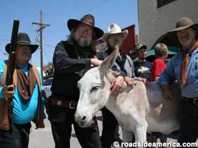 Gunfighters and burro in Oatman, Arizona.