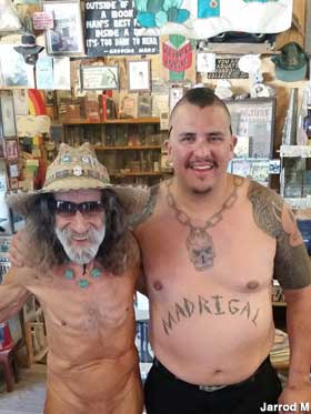 Naked bookstore owner and customer.