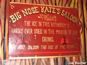 Sign over the urinals at Big Nose Kate's saloon.