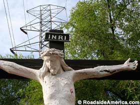 Jesus crucified near the utility tower.