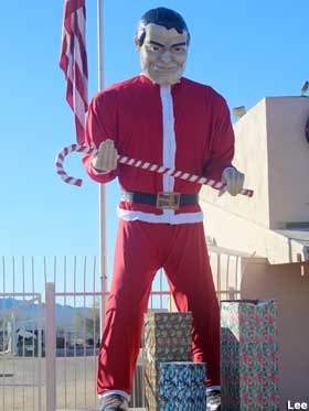 Muffler Man in Santa suit.