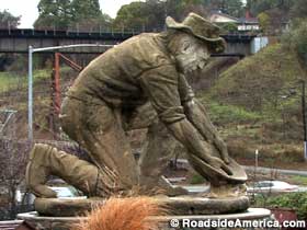Gold rush miner statue.