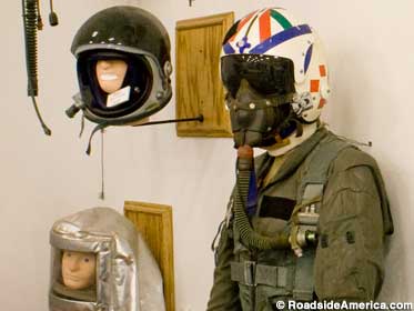 Helmets and flight suits.