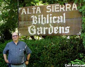 Biblical Gardens sign and Carl Ambrose.