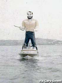 Muffler Man in a motor boat.