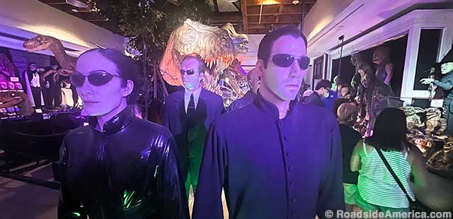 The cast of The Matrix are too cool to notice the Jurassic Park dinosaurs.