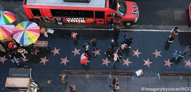 Bird's-eye view of the Hollywood Walk of Fame, complete with tour bus and tourists.