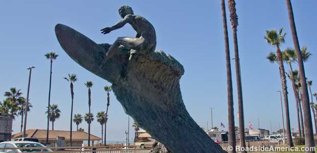 Naked surfer statue.