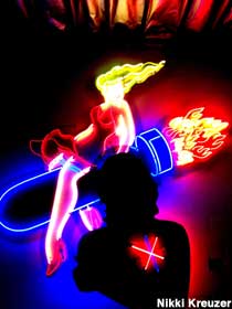 Neon lady on a bomb.