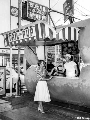 French actress Brigitte Auber samples a USA hot dog in 1954.