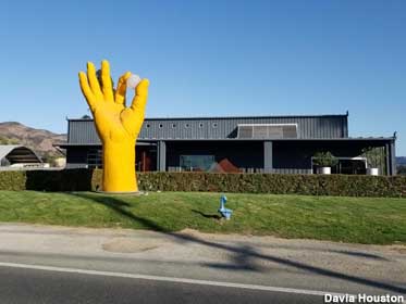 Giant hand on the lawn of an artist's studio.