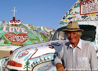 Leonard Knight leans on his truck near Salvation Mountain.