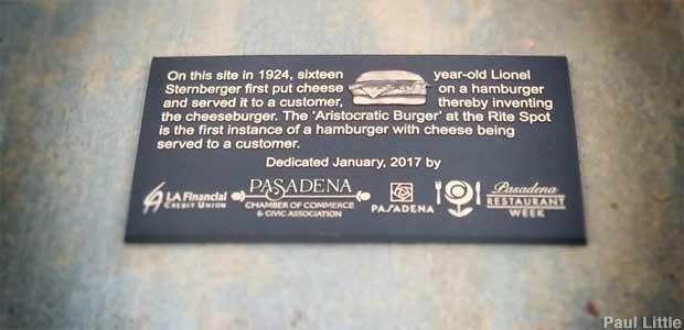 Birthplace of the Cheeseburger sidewalk plaque.