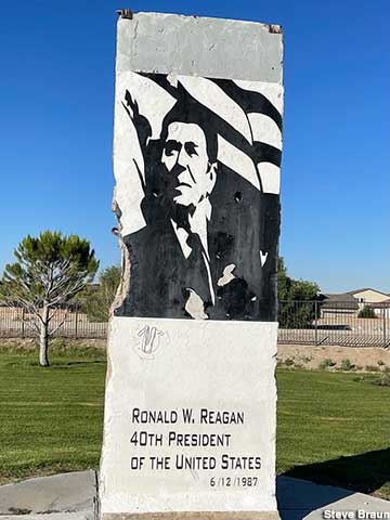 Ronald Reagan portrayed on a slab of the Berlin Wall.