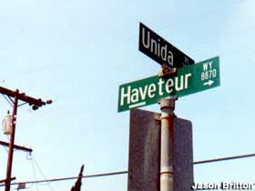 Unida Place and Haveteur Way signs.