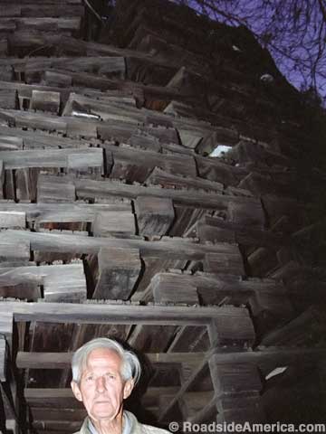 Van Meter stands at the entrance to his Tower of pallets.
