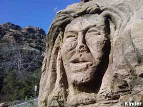 Carved face of a woman.