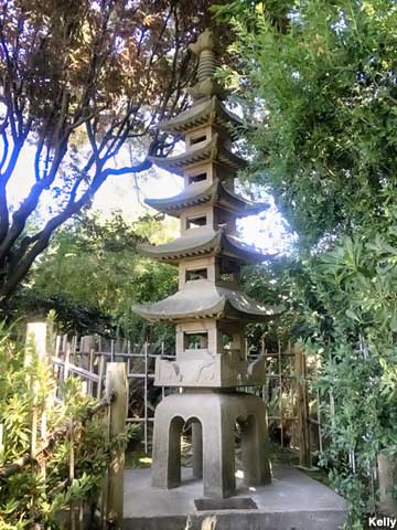 Concrete pagoda and plaque in the San Mateo Japanese Tea Garden.