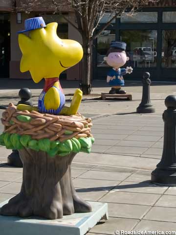Peanuts characters on street corners.