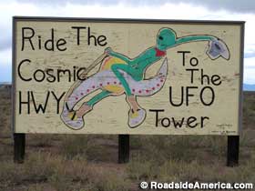 Sign: Ride the Cosmic Hwy to the UFO Tower.