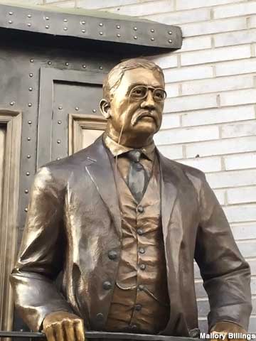 Teddy Roosevelt on a train sculpture.