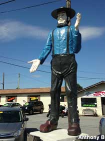 Amish man statue.