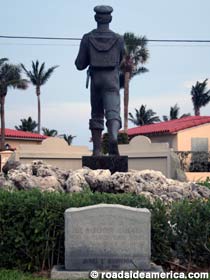 Rear view of the Barefoot Mailman statue.