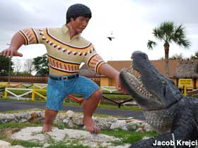 Gator wrestling statue.