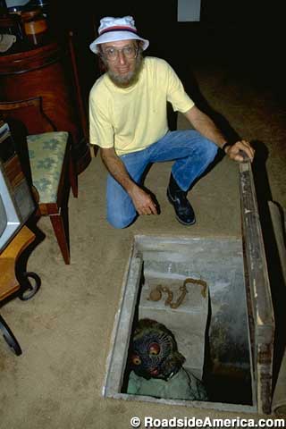 Howard reveals the dungeon in front of his TV, 1991.