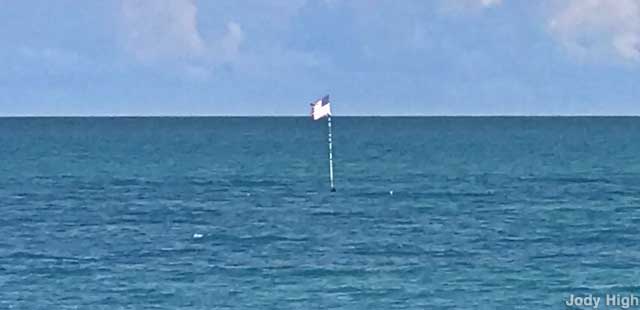 American flag marks wreck site.