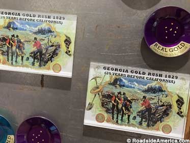 Miners' pan fridge magnets have glued-in flecks of real gold.
