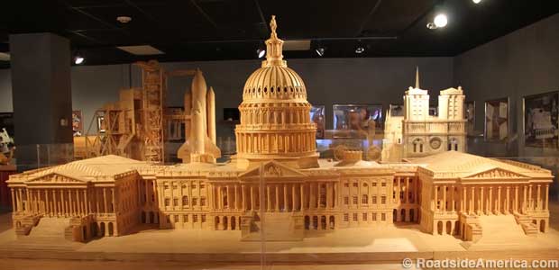 U.S. Capitol made of 478,000 matchsticks. In the background: Space Shuttle Challenger and Notre Dame Cathedral.