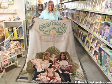 One-of-a-kind blanket with Donna, her daughter and granddaughter, sitting in a giant cabbage.