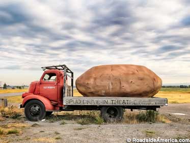 Giant potato on a truckbed.