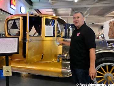 Executive director Bob Olson and the museum's gold-plated car: a Fort Knox on wheels.