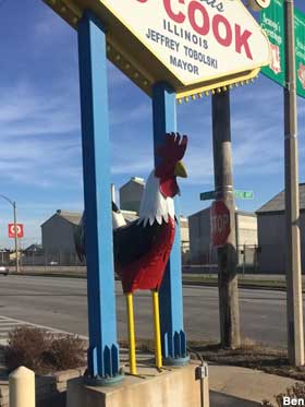 Sign and rooster.