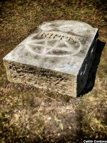 Vandalized tombstone.