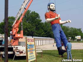 Stan the Tire Man hoisted off his spot in Salem.