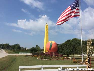 Monument and peach and American flag.