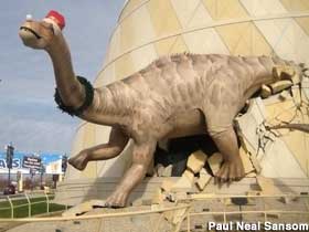 Dinosaur in santa hat.
