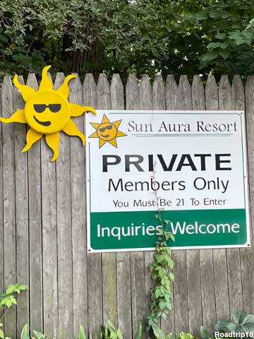 Sun Aura Resort sign.