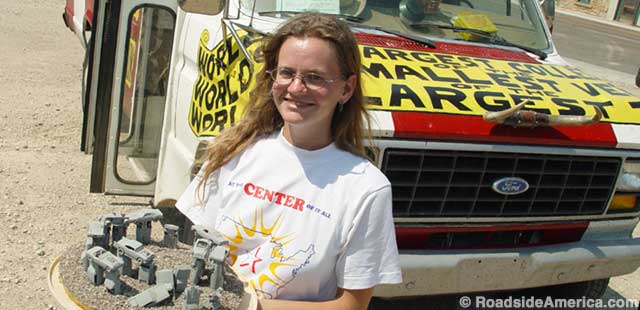 Erika on the road in 2003: with her Carhenge model and traveling museum.