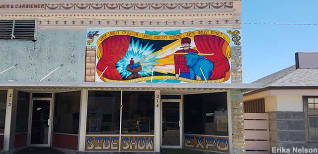 Expo outdoor mural shows the Bemidji, Minnesota, Bunyan and Babe being zapped into miniature form.