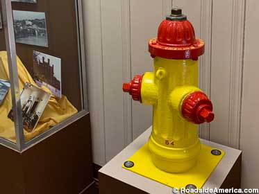 Old yellow and red fireplug from 1933.