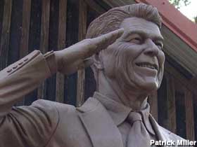 Ronald Reagan salutes.