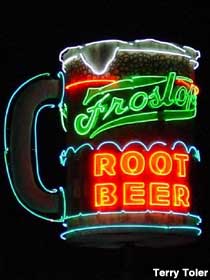 Rotating neon mug of Root Beer.