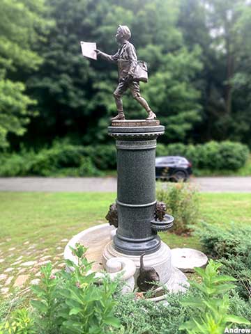 Newsboy statue and fountain.
