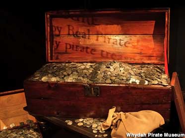 Chest overflows with silver coins savaged from the Whydah.