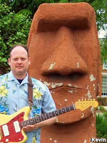 Guitar god and Easter Island head.
