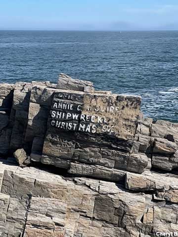 Faded inscription marking shipwreck.